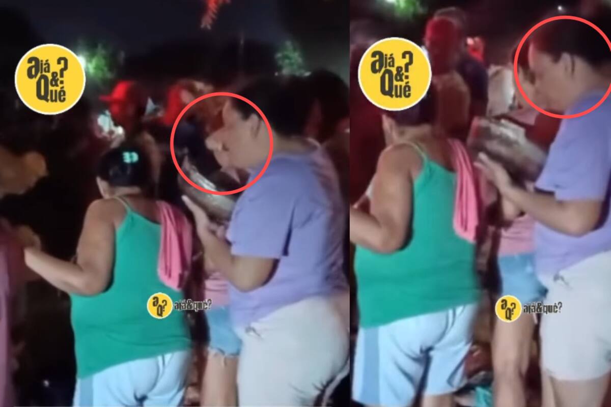 Mujer fue grabada observando el chisme mientras sostenía un sartén porque estaba cocinando y no quería perder detalle