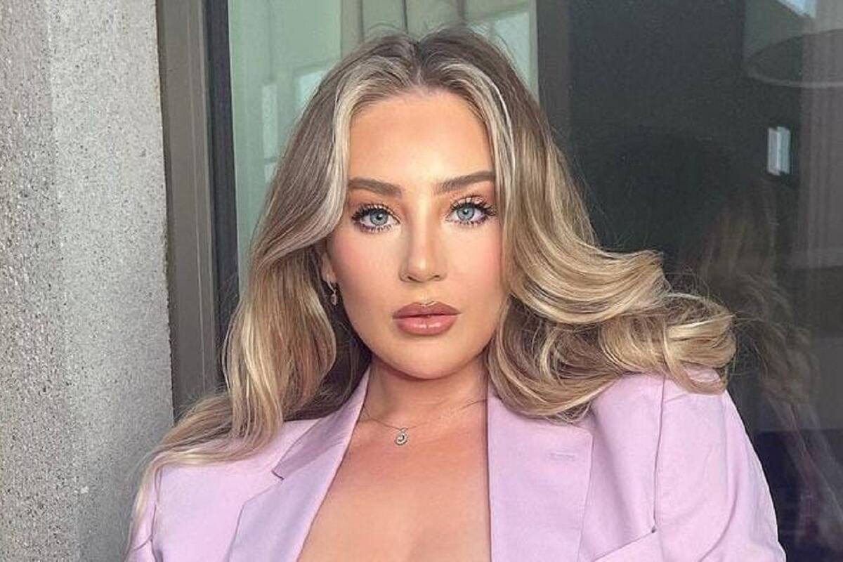 Bethany Lily April luce sus exuberantes encantos en sensual traje de baño en la playa