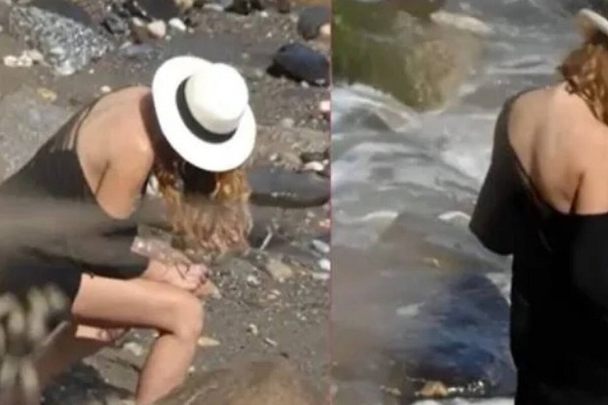 Captan a Paulina Rubio haciendo del baño en la playa: Se limpió con una roca
